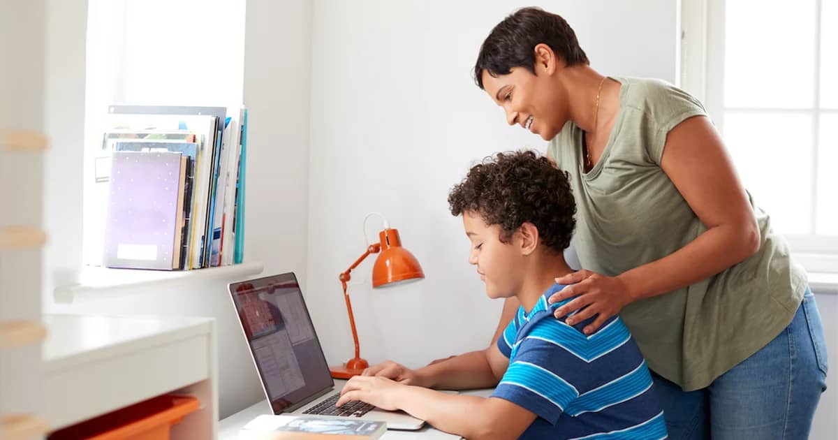 student on computer with parent copy-2
