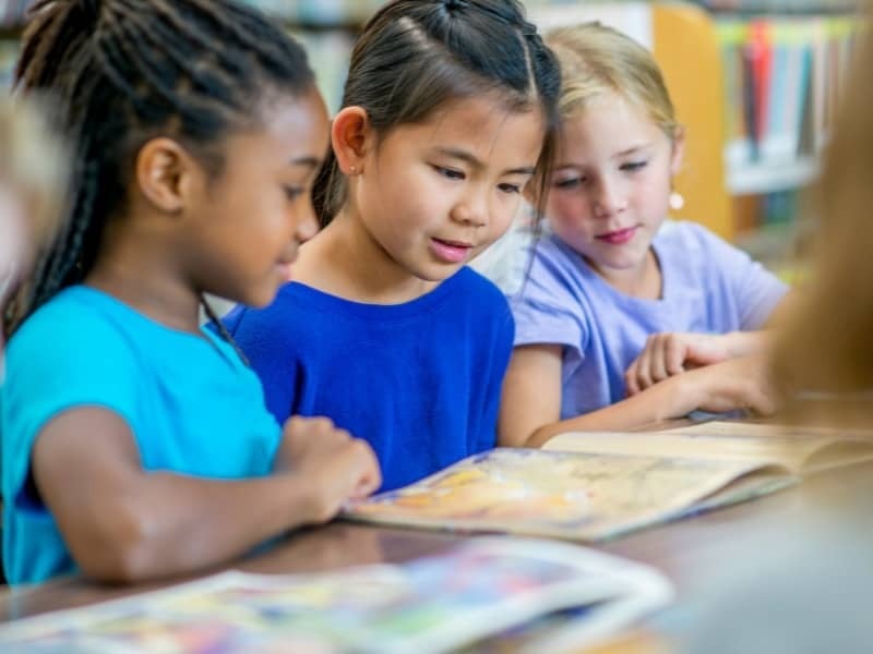 Children reading together in class