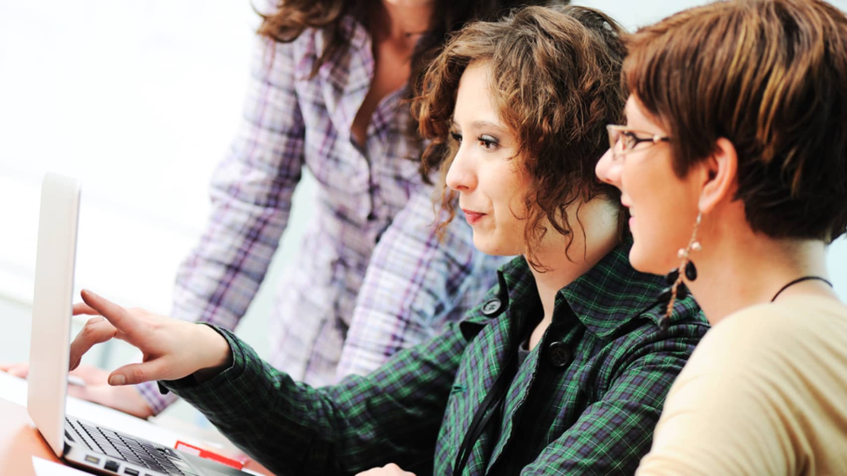 women-pointing-at-laptop women-pointing-at-laptop
