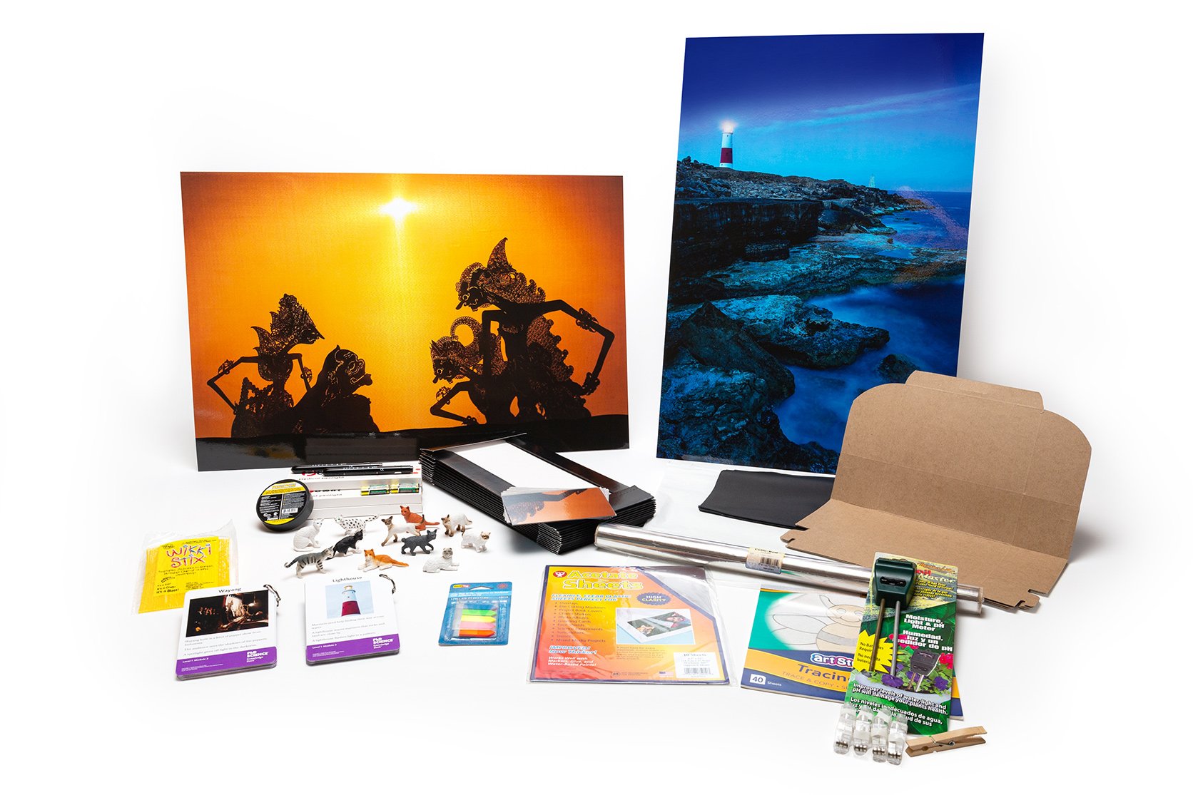 PhD Science hands-on materials kit from Level 1 Module 2 that includes a light meter, cardboard boxes, Knowledge Deck cards and posters, and penlights