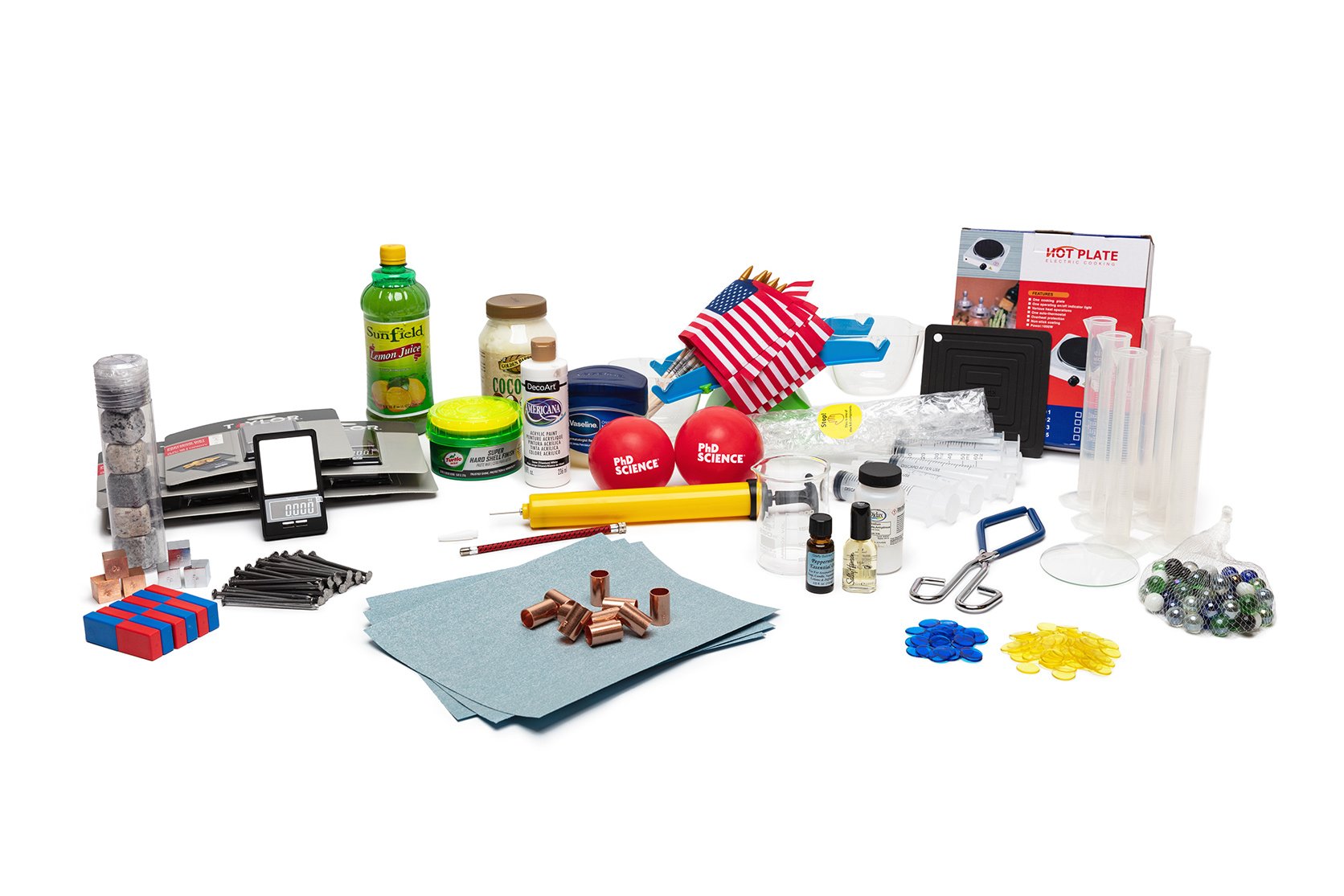 PhD Science hands-on materials kit from Level 5 Module 1 that includes sandpaper, lemon juice concentrate, graduated cylinders, and rubber balls