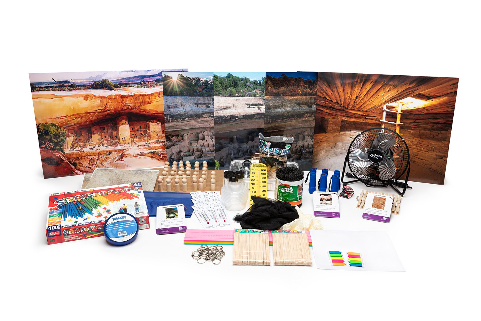 PhD Science hands-on materials kit from Level K Module 1 that includes a fan, wooden dolls, Knowledge Deck cards and posters, and safety goggles