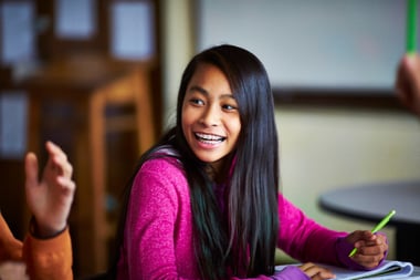 girl laughing and looking left