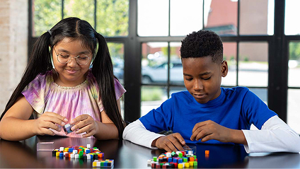 EM2-two students filling prisms