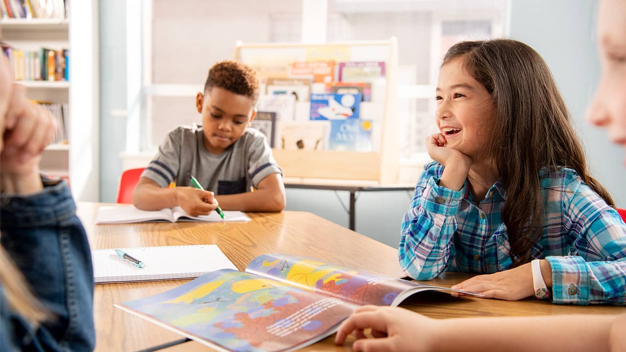 Kids on Desk with Books