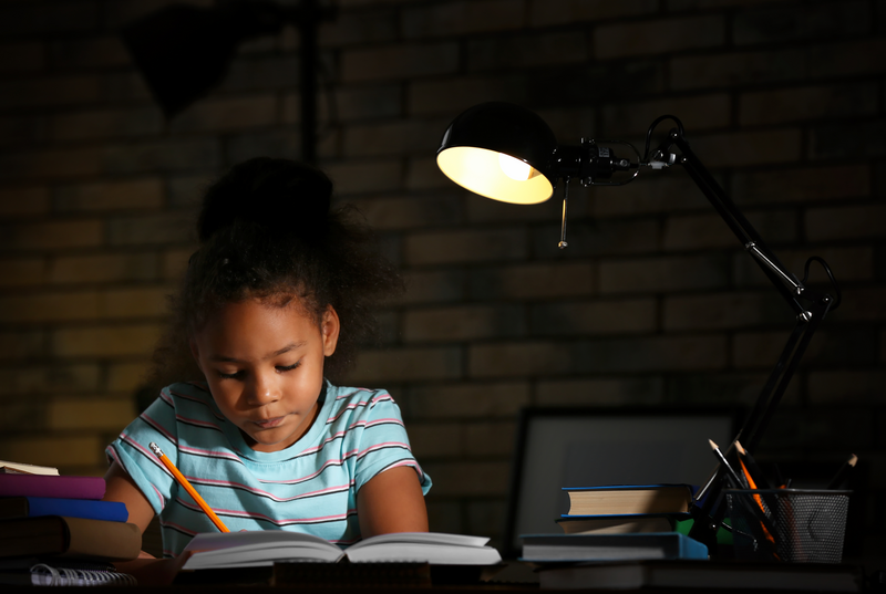Girl doing homework at night