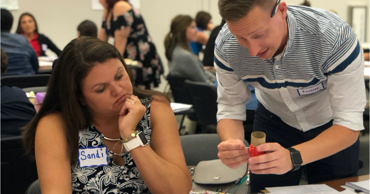 Two educators working together in a PD session. 